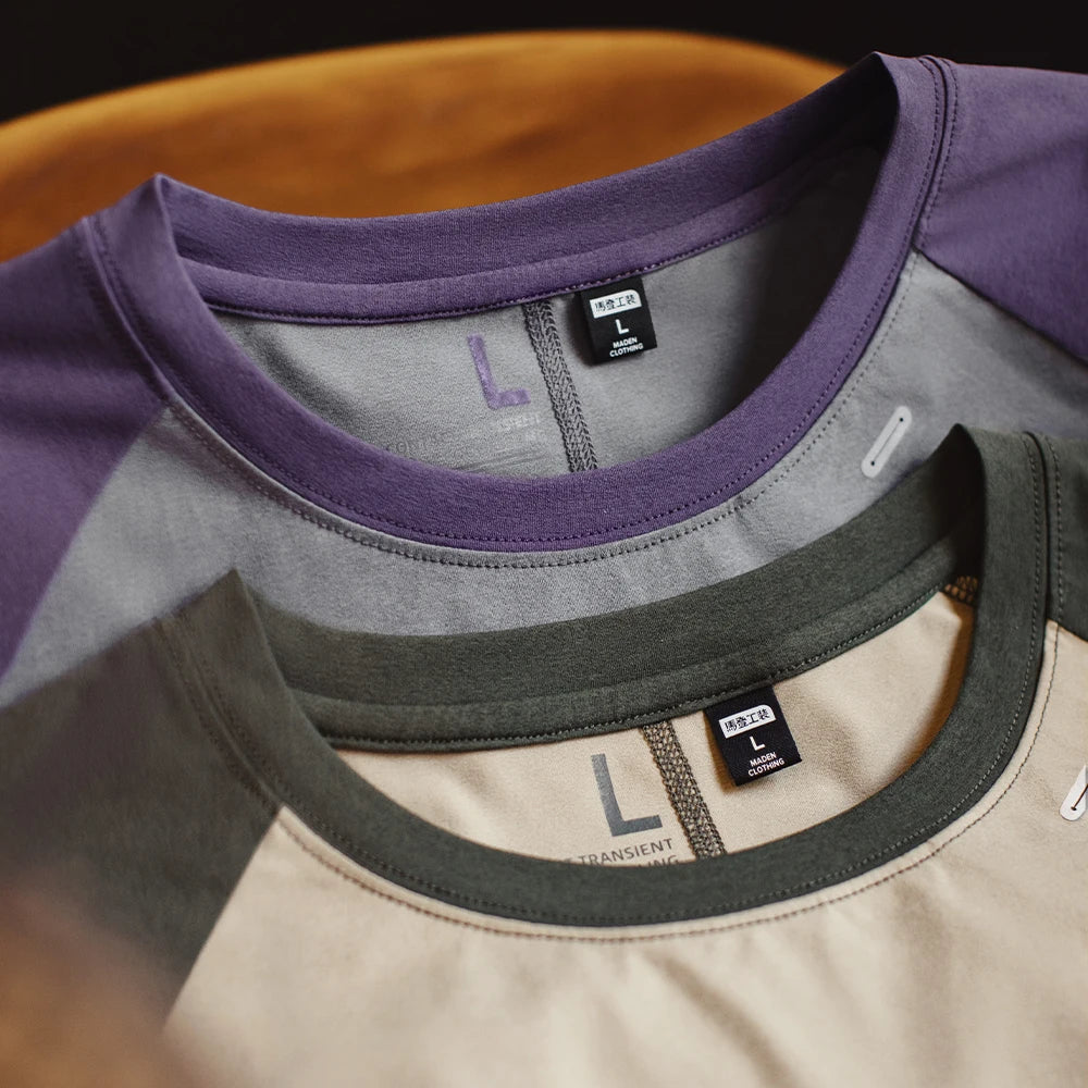 Close-up of three shirts with different color combinations on a blurred background
