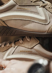 Close-up of brown shoes with 'Speedway' branding on a blurred background