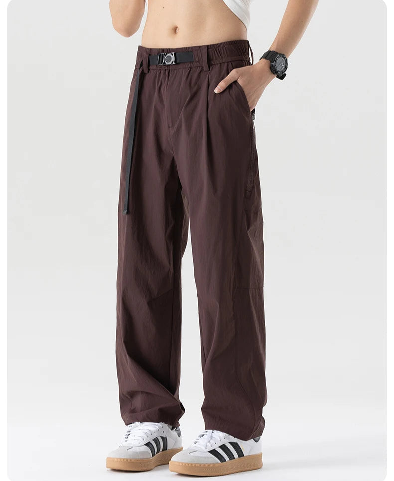 Brown pants worn by a person on a white background