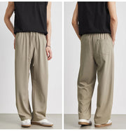Beige wide-leg pants worn by a person on a white background