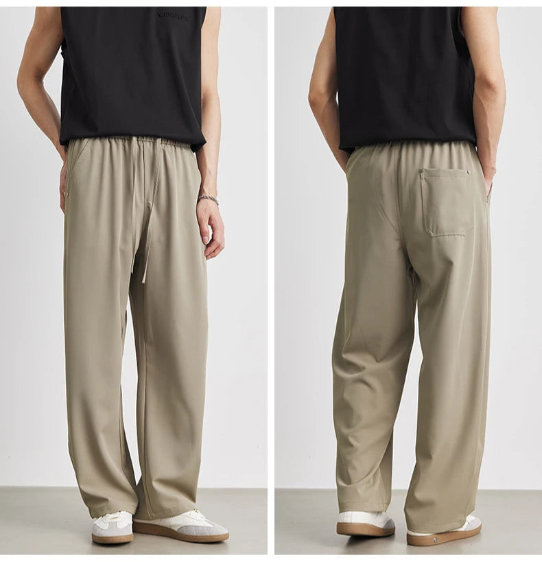 Beige wide-leg pants worn by a person on a white background