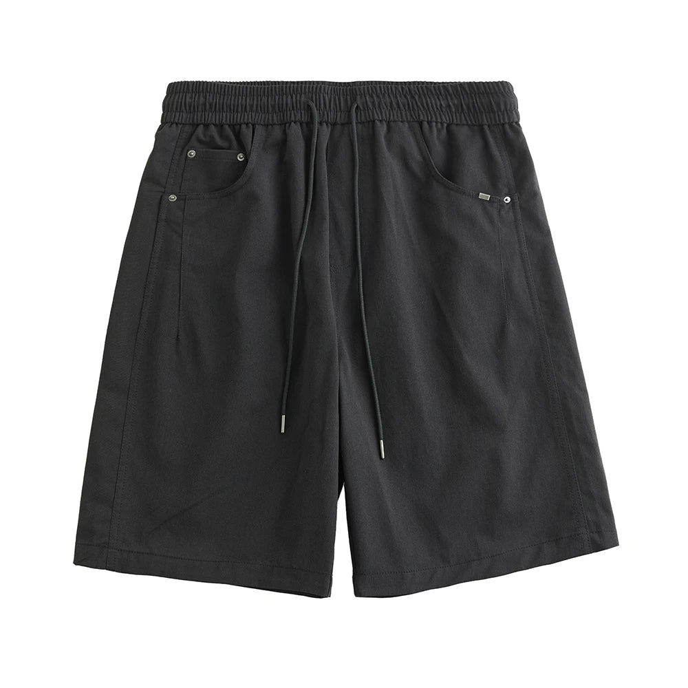 Black shorts with drawstring on a white background