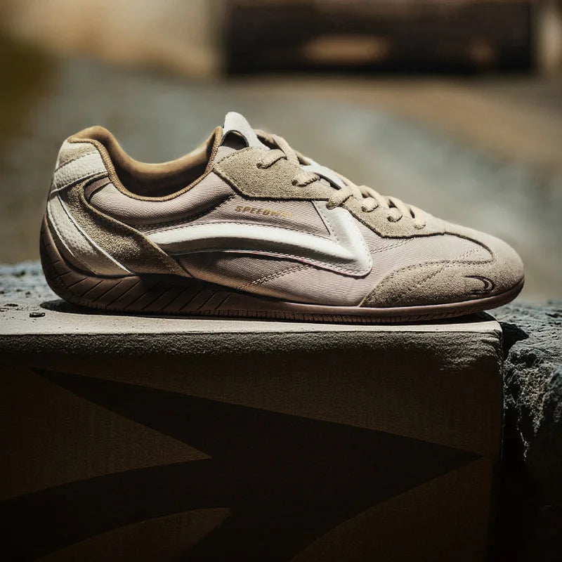 Beige sneaker on a stone surface with a blurred background