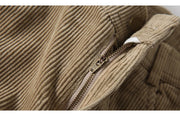 Close-up of a beige corduroy jacket with a zipper
