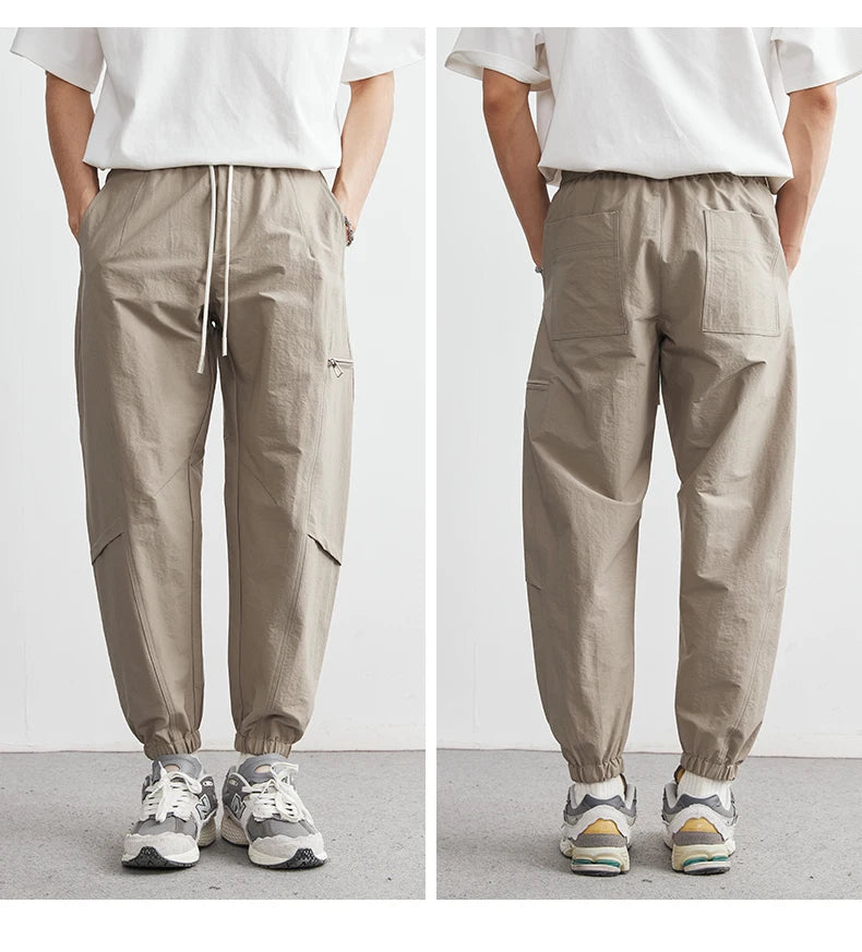 Beige pants worn by a person on a plain background