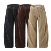 Three pairs of corduroy pants in black, brown, and beige on a white background