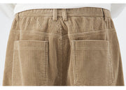Close-up of beige corduroy pants with pockets on a white background