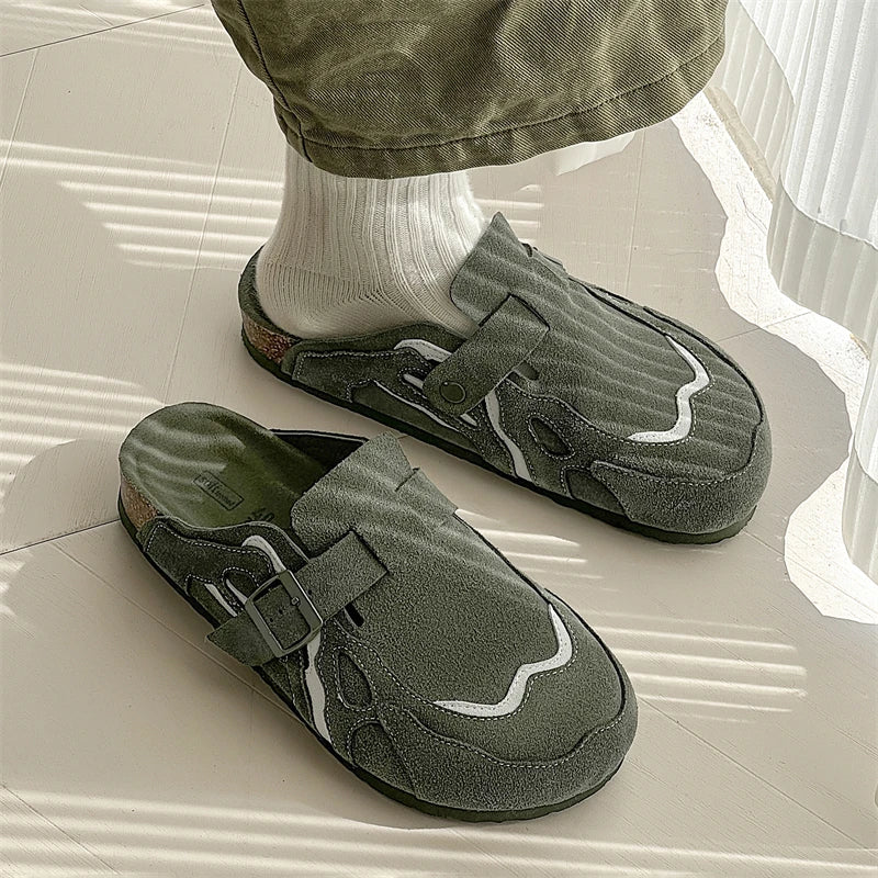 Green slippers worn indoors on a light-colored floor