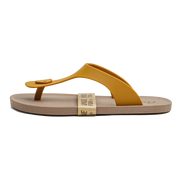 A single thong sandal shown in profile on a plain white background. The upper strap is mustard yellow, while the footbed is a light tan/beige color.
