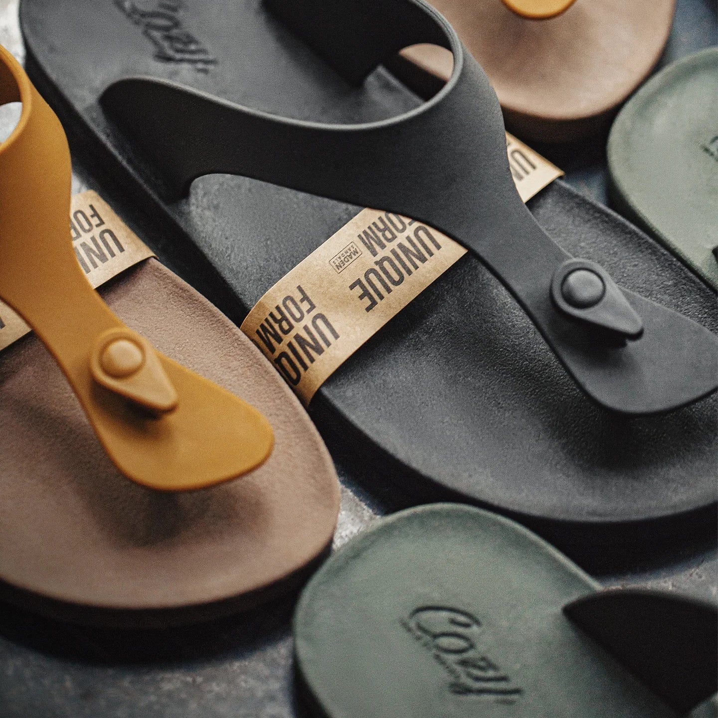 Collection of sandals in various colors.